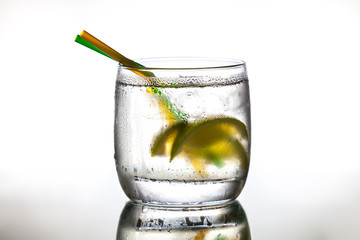 Cocktail with ice and lime slice
