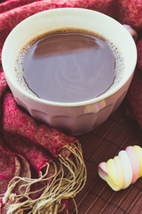 Cup of chocolate on wooden surface