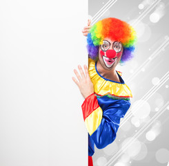 Clown showing a blank board