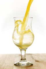 Pouring orange juice into glass
