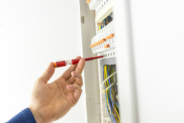 Electrician testing an electrical circuit board