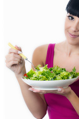 Young Woman Eating Green Salad