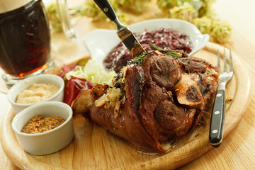 eisbein with braised cabbage, mashed potato, and beer