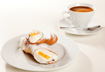 Cannolo with coffee cup
