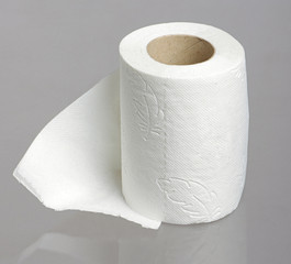 Toilet paper roll on the studio grey background