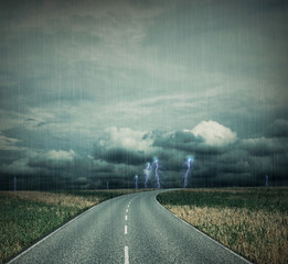 Empty country-road at a apocalyptic thunderstorm