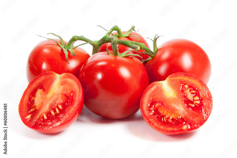 Wall mural three fresh tomatoes with green leaves isolated on white backgro