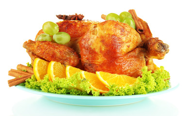 whole roasted chicken with lettuce, grapes, oranges and spices