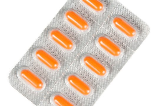 top of view of orange pills packed in blister isolated