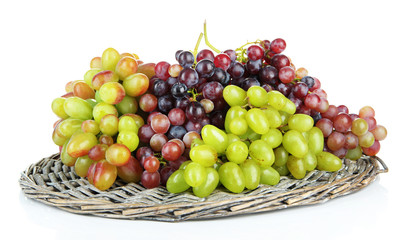Fresh grape on wicker mat isolated on white