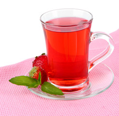 Delicious strawberry tea on table on white background