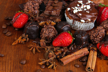 Tasty cupcake with different sweets close up