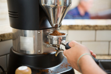 Barista Grinding Coffee