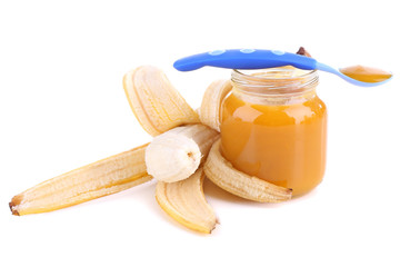 Fototapeta na wymiar Jars of baby food with banana, isolated on white