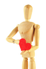 Wooden mannequin holding red heart isolated on white