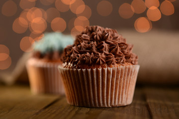 Tasty cupcakes with butter cream,
