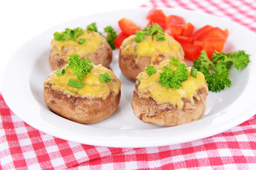 Stuffed mushrooms on plate on table close-up