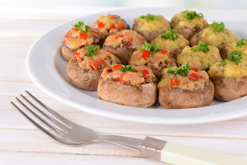 Stuffed mushrooms on plate on table close-up