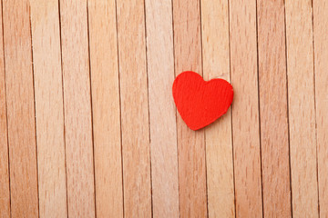 Fototapeta premium red heart over a wooden background