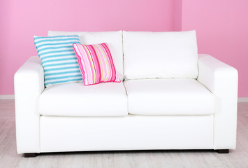 White sofa in room on pink background