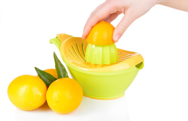 Preparing fresh lemon juice squeezed with hand juicer isolated