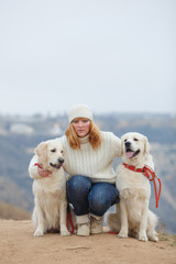 Beautiful girl with her dog near sea