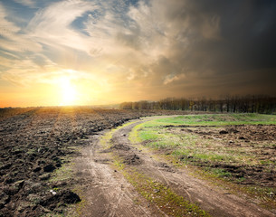 Country road and plowed land