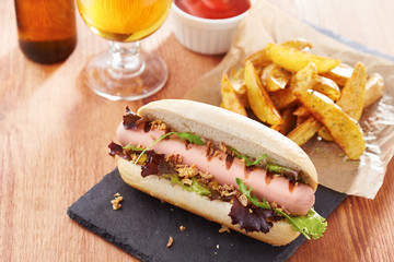 Gourmet hot dog on slate board