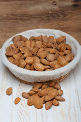 Almonds in shell on wooden table still life