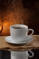 Cup of hot coffee with steam