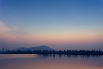 Fototapeta na wymiar The view of lake at sunset 