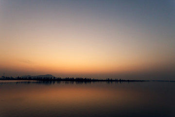 Fototapeta na wymiar The view of lake at sunset 