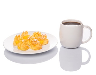 Homemade cream puff and a mug of coffee