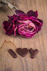 the dried rose with chocolate inscription 