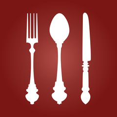 Fork Knife and Spoon on red dark background