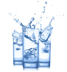 Water splash in glasses isolated on white