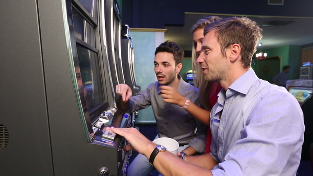Group of Friend Playing with Slot Machines