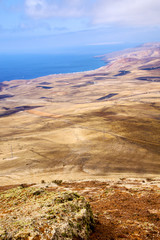 coastline lanzarote view from the top  and house field