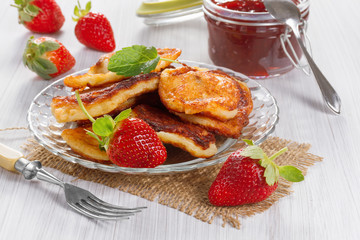 Fritters with strawberry jam and fresh strawberries