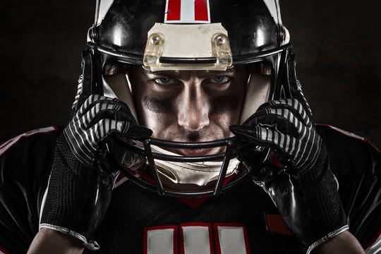 Portrait Of American Football Player Looking At Camera