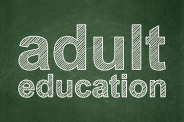 Obraz premium Education concept: Adult Education on chalkboard background