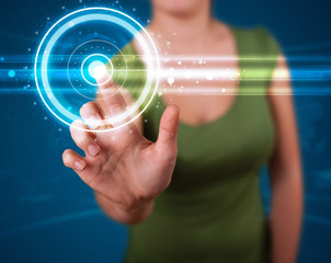 Woman pressing high tech type of modern buttons