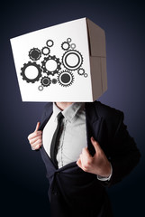 Businessman gesturing with a cardboard box on his head with spur