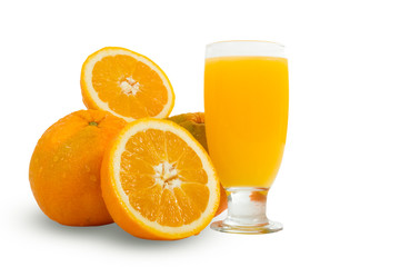 Glass of fresh orange juice with sliced oranges on white backgro