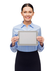 smiling businesswoman with blank tablet screen