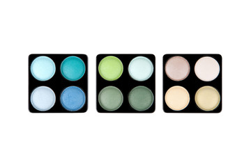 Three eyeshadow palettes isolated on white