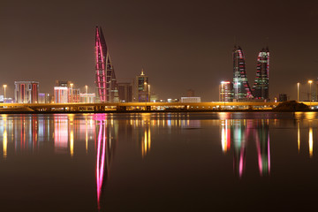 Skyline of Manama at night. Bahrain, Middle East - obrazy, fototapety, plakaty