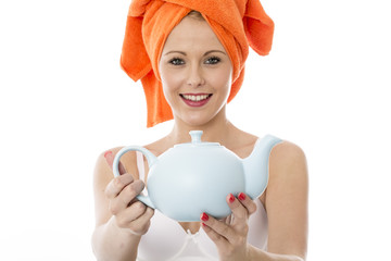 Attractive Young Woman Holding a Teapot