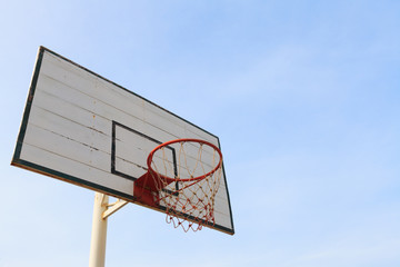 Old empty basketball basket and backboard