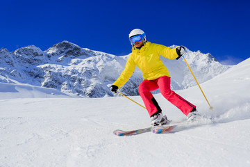 Fototapeta na wymiar Skiing, skier, winter sport - woman skiing downhill